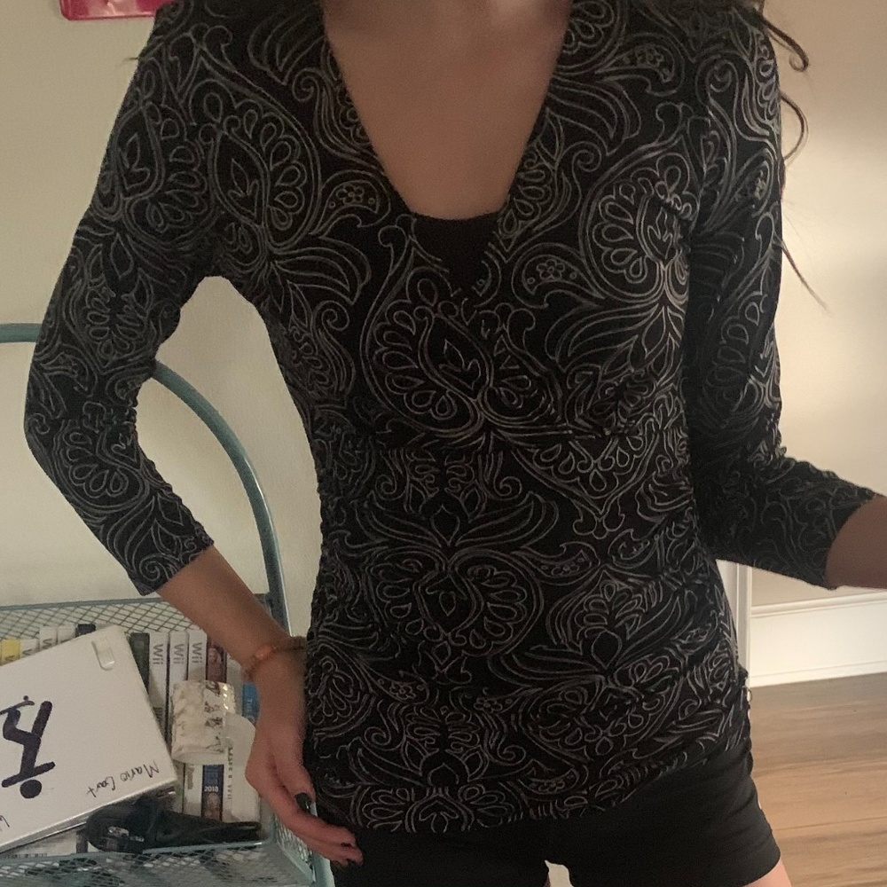 a black long sleeve shirt by Harolds